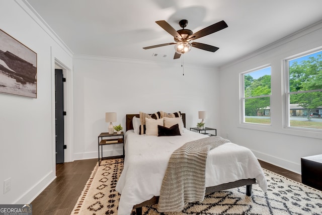 bedroom with ceiling fan, crown molding, and dark wood-type flooring