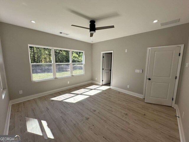 unfurnished bedroom featuring light hardwood / wood-style floors and ceiling fan