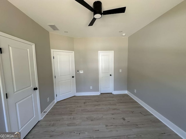 unfurnished bedroom featuring light hardwood / wood-style floors and ceiling fan