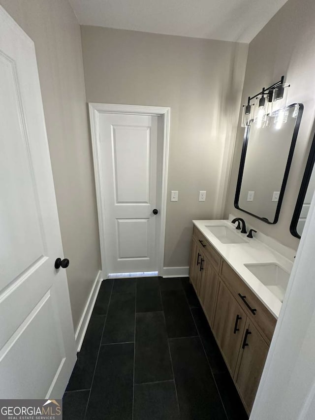 bathroom with vanity and tile patterned flooring