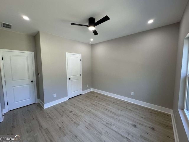 unfurnished bedroom featuring ceiling fan and light wood-type flooring