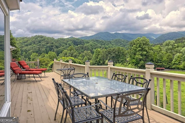 wooden terrace featuring a mountain view