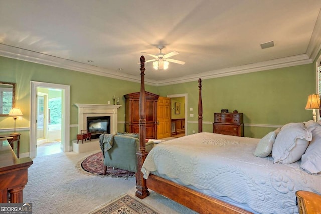 bedroom with light carpet, connected bathroom, ceiling fan, and crown molding