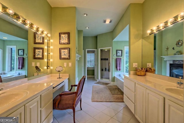 bathroom featuring vanity, a fireplace, plus walk in shower, and tile patterned flooring