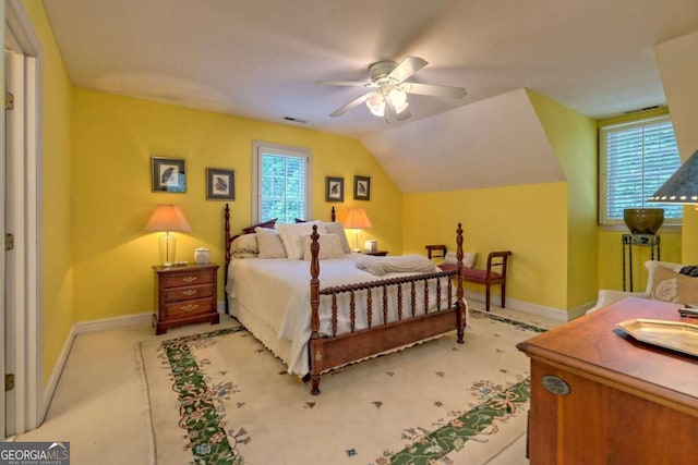 bedroom with ceiling fan and lofted ceiling