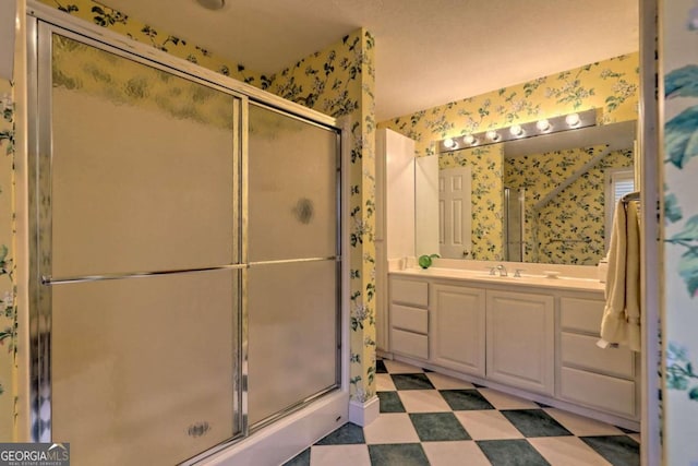 bathroom with vanity and an enclosed shower