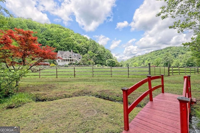 view of yard with a rural view