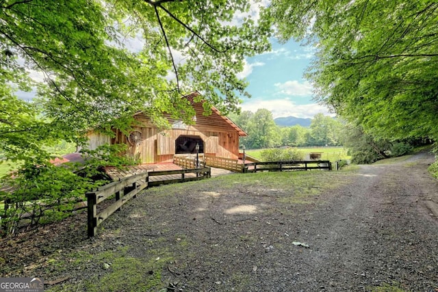 view of property's community featuring an outdoor structure