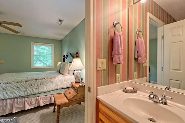 bathroom with ceiling fan and vanity