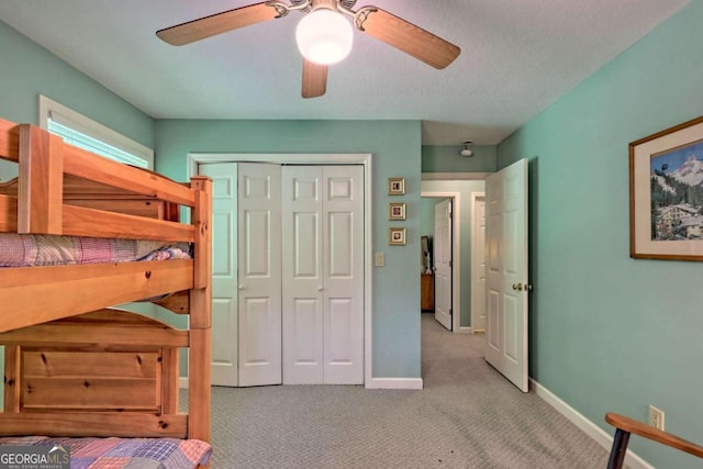 bedroom with light carpet, a closet, and ceiling fan