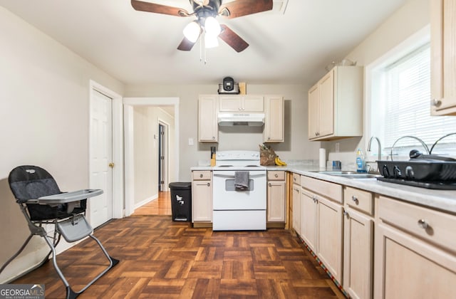 kitchen featuring dark parquet flooring, white range with electric stovetop, ceiling fan, and sink