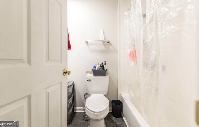 bathroom with tile patterned flooring, toilet, and shower / bath combo with shower curtain