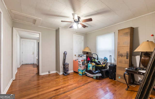 miscellaneous room featuring ceiling fan, ornamental molding, and hardwood / wood-style flooring