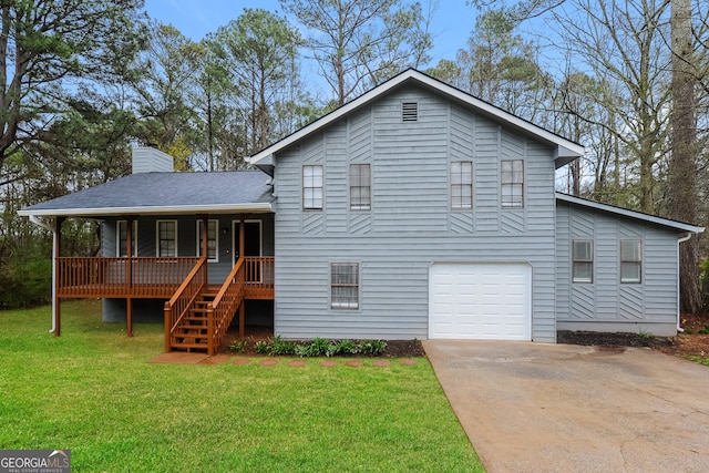 view of front of property with a garage, a front yard, and covered porch