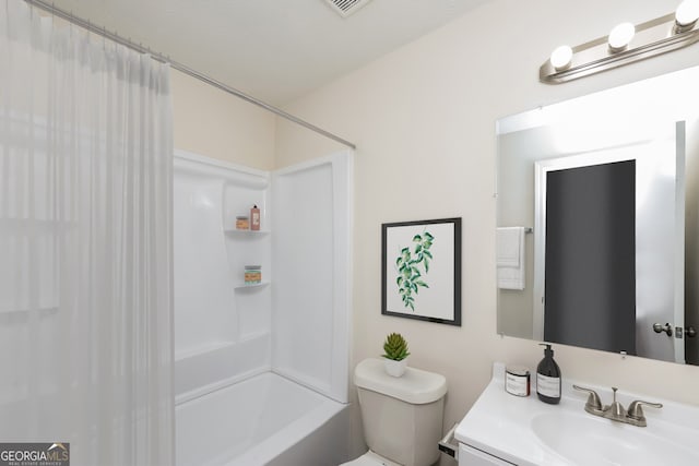 bathroom featuring toilet and vanity