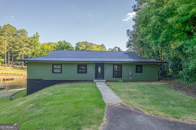 ranch-style home featuring a front yard