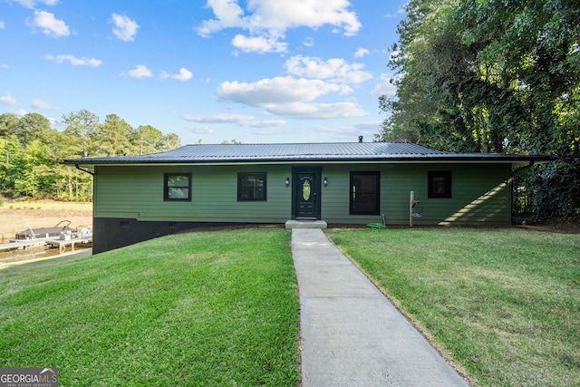 ranch-style home with a front lawn