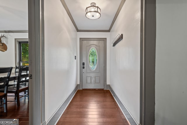 doorway to outside featuring dark hardwood / wood-style flooring and ornamental molding