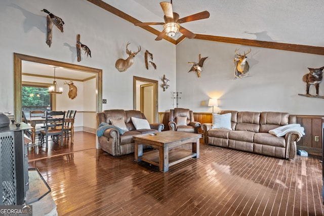 living room featuring ceiling fan with notable chandelier, a textured ceiling, vaulted ceiling, crown molding, and hardwood / wood-style flooring