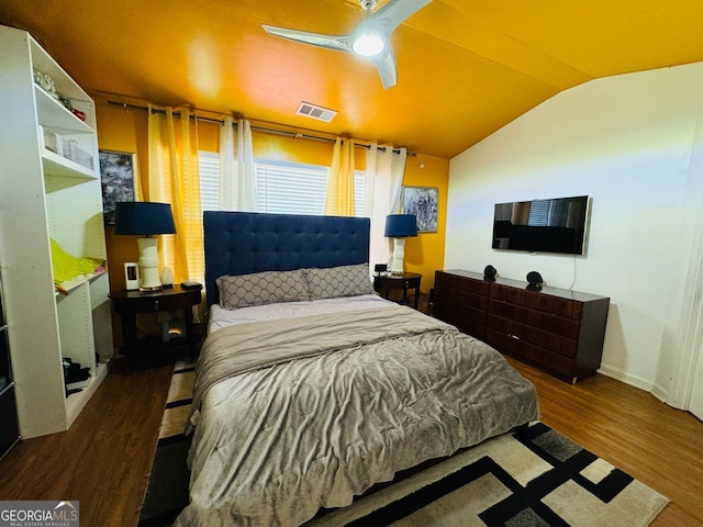 bedroom with lofted ceiling, wood-type flooring, and ceiling fan