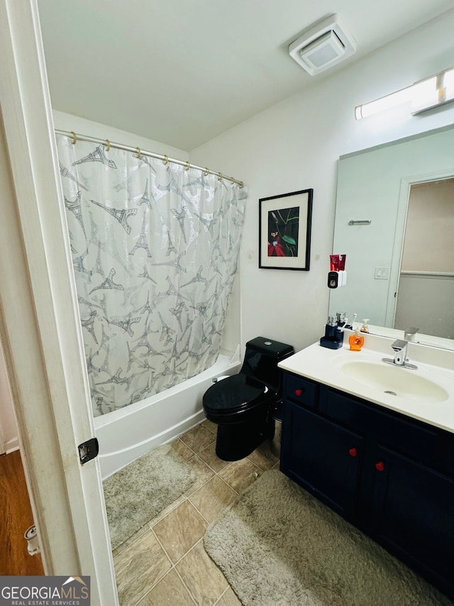 full bathroom with vanity, tile patterned flooring, toilet, and shower / tub combo with curtain