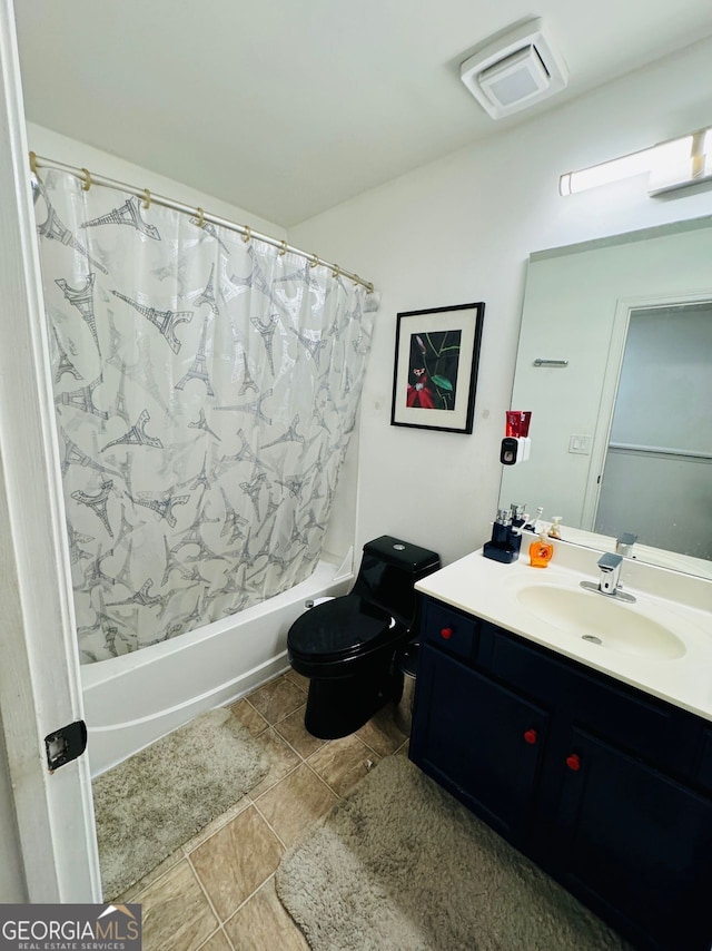 full bathroom featuring vanity, toilet, tile patterned floors, and shower / bath combination with curtain