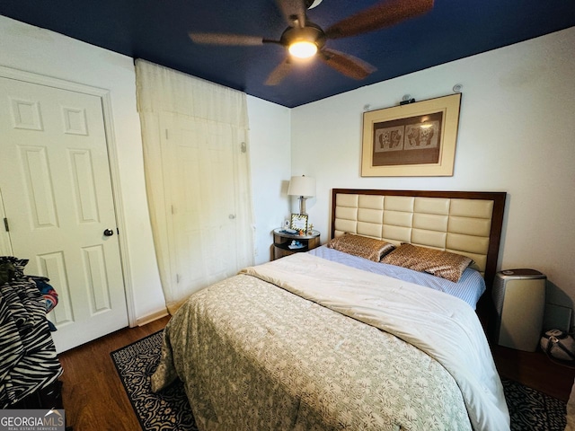 bedroom featuring dark hardwood / wood-style flooring and ceiling fan