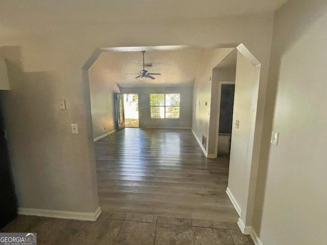 hallway with dark hardwood / wood-style flooring