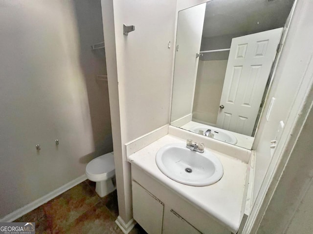 bathroom with vanity and toilet