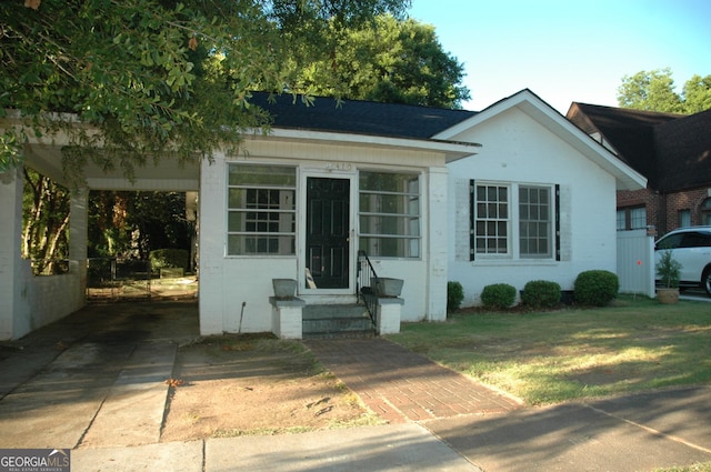 view of front of home featuring a carport