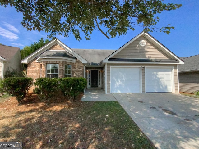 ranch-style house featuring a garage