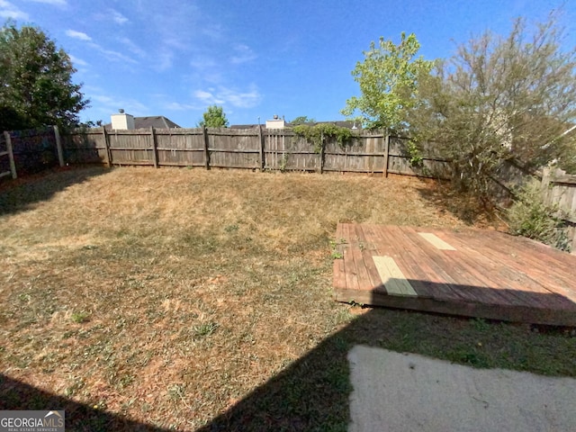 view of yard with a wooden deck