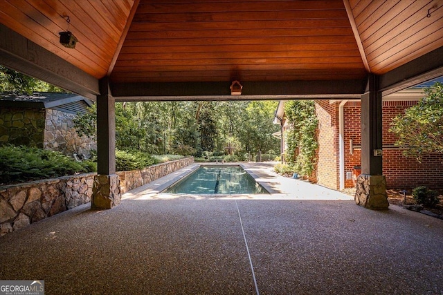 view of swimming pool with a gazebo and a patio area