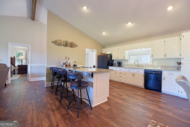 kitchen with black appliances, dark hardwood / wood-style flooring, and white cabinetry