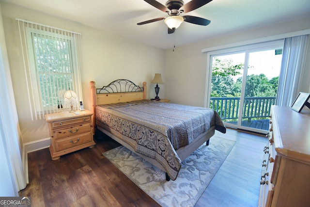 bedroom featuring dark hardwood / wood-style floors, ceiling fan, and access to outside