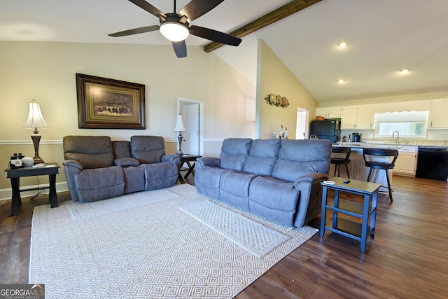 living room with beam ceiling, dark hardwood / wood-style floors, ceiling fan, and sink