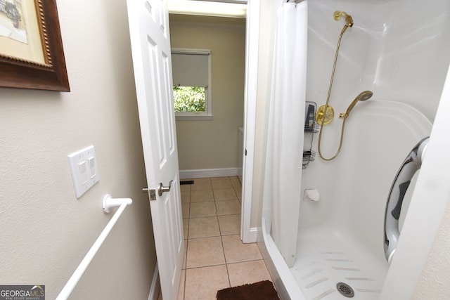 bathroom featuring tile patterned flooring and walk in shower