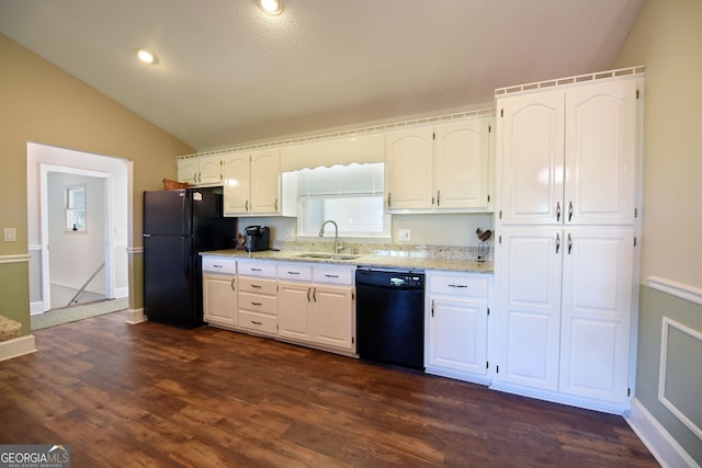 kitchen featuring vaulted ceiling, dark wood-type flooring, sink, black appliances, and white cabinets