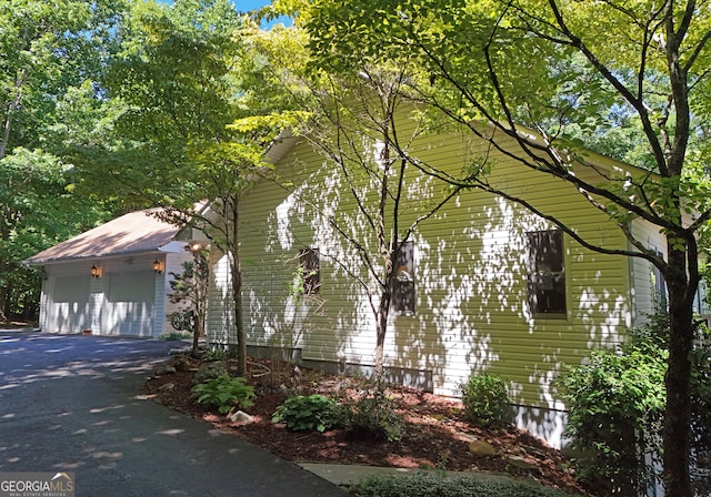 view of property exterior featuring a garage