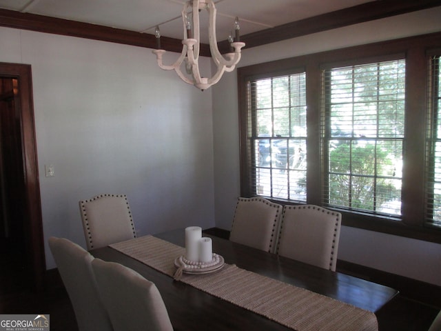 dining space with a chandelier