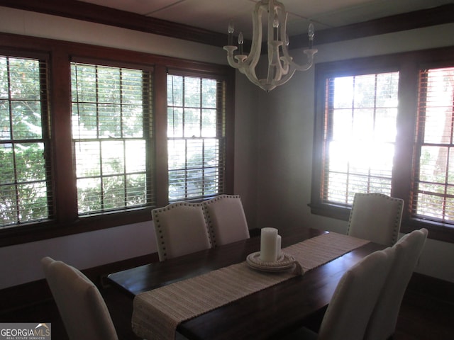 dining space featuring a healthy amount of sunlight and a chandelier