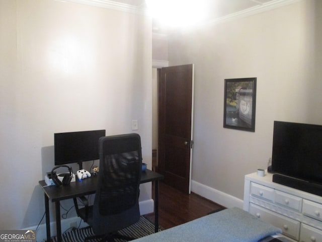 office area with ornamental molding and dark wood-type flooring