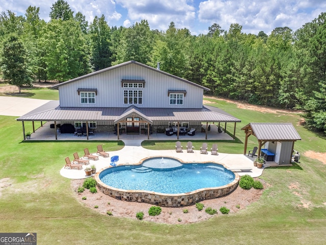 rear view of property with a patio and a lawn