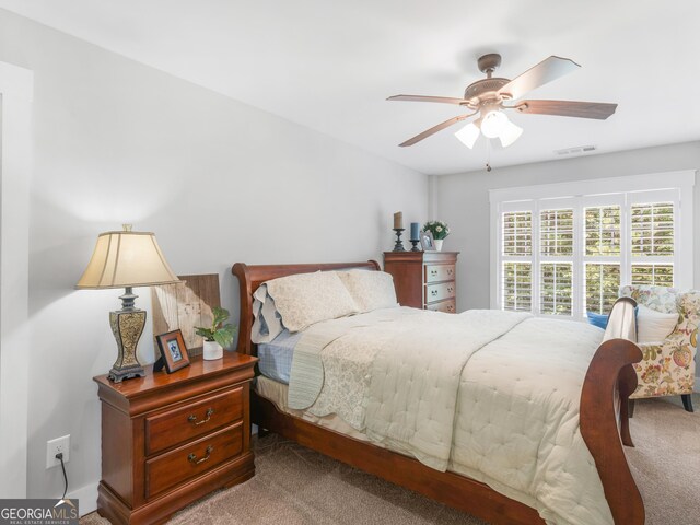 carpeted bedroom featuring ceiling fan