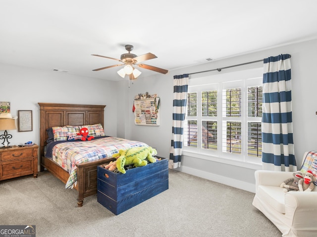 bedroom with light carpet and ceiling fan