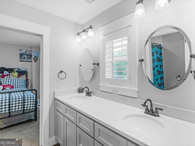 bathroom with dual vanity