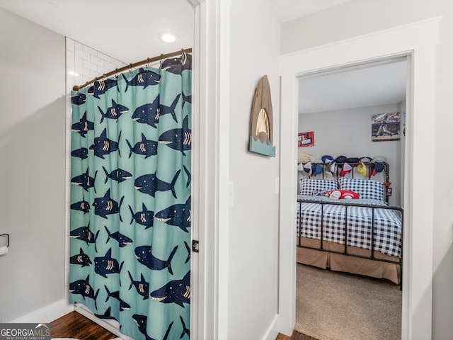 bathroom with wood-type flooring