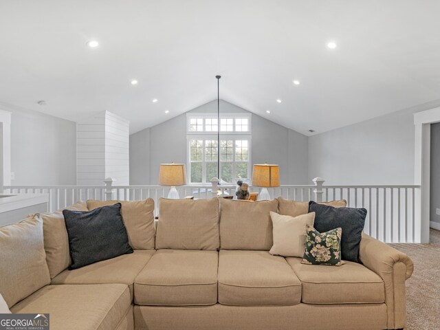 living room featuring an inviting chandelier, carpet, and lofted ceiling