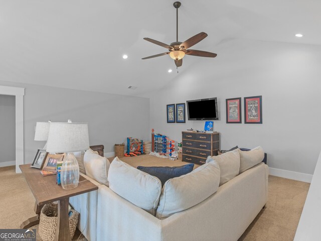 living room with carpet floors, ceiling fan, and lofted ceiling