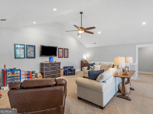 living room featuring carpet floors, ceiling fan, and high vaulted ceiling